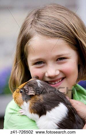 Girl with a guinea-pig View Large Photo Image Stock Image - Girl with a guinea-pig. Fotosearch
