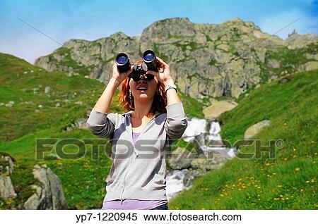 Girl with binoculars in mountains View Large Photo Image Stock Photography - Girl with binoculars in mountains. Fotosearch