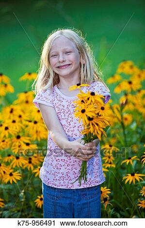 Stock Image - girl with bouquet of flowers. Fotosearch