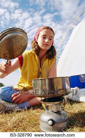 Girl with camp stove. View Large Photo Image Stock Image - Girl with camp stove.. Fotosearch