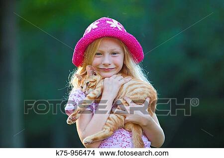 girl with cat and hat View Large Photo Image Picture - girl with cat and hat. Fotosearch