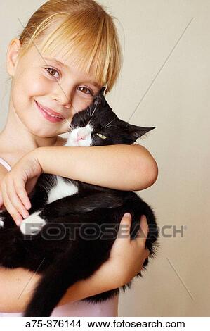 Girl with cat View Large Photo Image Picture - Girl with cat. Fotosearch
