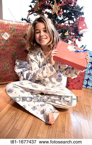 Girl with Christmas gifts View Large Photo Image Stock Photo - Girl with Christmas gifts. Fotosearch