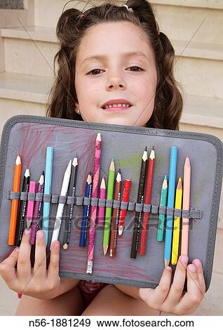Girl with color crayons View Large Photo Image Stock Photo - Girl with color crayons. Fotosearch