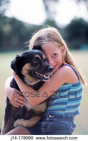 Girl with dog View Large Photo Image Stock Photo - Girl with dog. Fotosearch