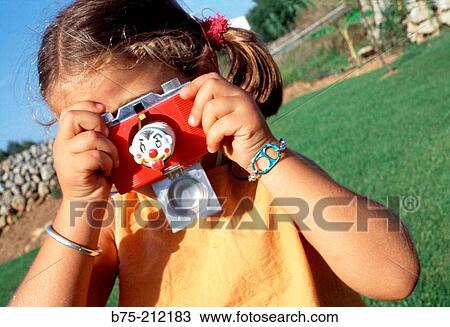 Girl with fake camera View Large Photo Image Stock Image - Girl with fake camera. Fotosearch