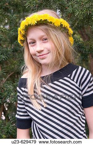Stock Photo - Girl with flowers in her hair.. Fotosearch