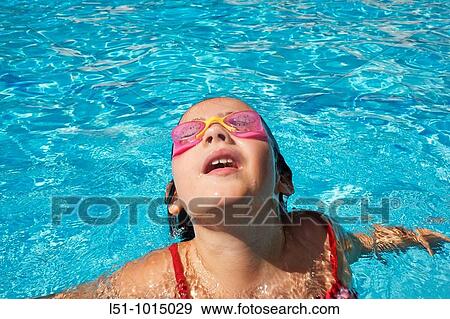 Girl with goggles on a swimming pool in Ludiente, Castell? n View Large Photo Image Stock Photo - Girl with goggles on a swimming pool in Ludiente, Castell? n. Fotosearch