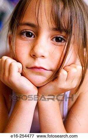 Girl with hands on cheeks View Large Photo Image Stock Photo - Girl with hands on cheeks. Fotosearch