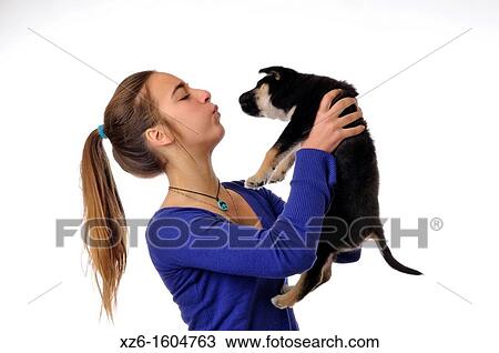 Stock Image - Girl with her dog pet. Fotosearch