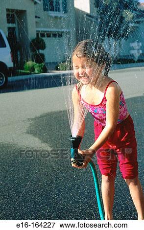 Girl with hose View Large Photo Image Stock Photo - Girl with hose. Fotosearch