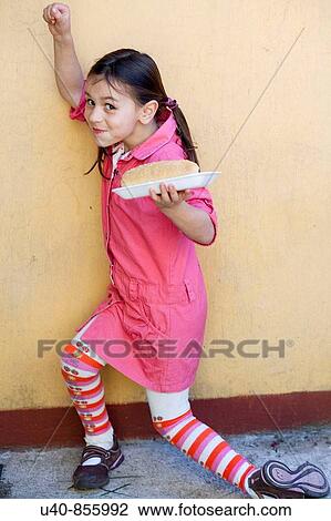 Girl with hot dog View Large Photo Image Stock Image - Girl with hot dog. Fotosearch