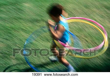 Girl with hula hoop View Large Photo Image Stock Image - Girl with hula hoop. Fotosearch
