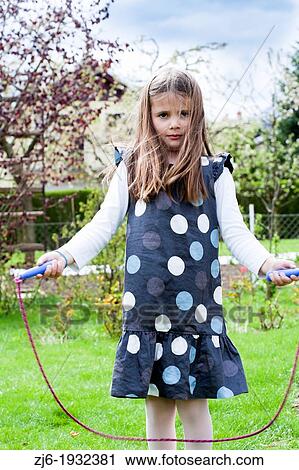 Stock Image - Girl with jumping rope.. Fotosearch