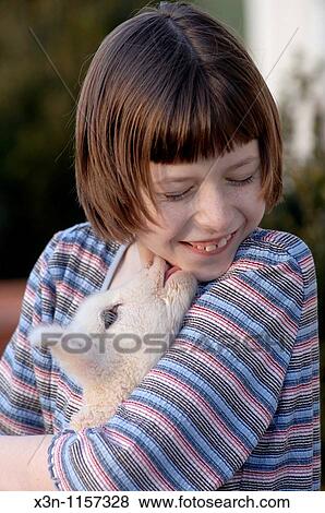 Stock Photo - Girl with lamb. Fotosearch