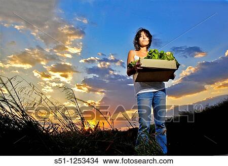 Picture - Girl with lettuce box. Fotosearch