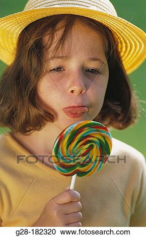Girl with lollipop View Large Photo Image Stock Image - Girl with lollipop. Fotosearch
