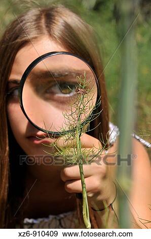girl with magnifying glass in a natural science class in the field View Large Photo Image Stock Photo - girl with magnifying glass in a natural science class in the field. Fotosearch