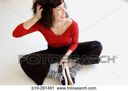 Stock Image - Girl with mobile phone. Fotosearch