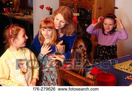 Girl with mother and friends at 7th Birthday party View Large Photo Image Stock Photograph - Girl with mother and friends at 7th Birthday party. Fotosearch