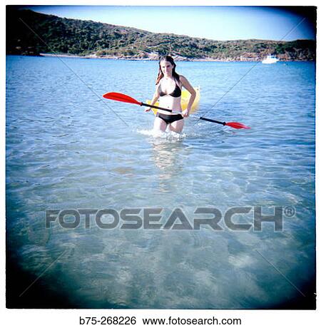 Girl with paddle View Large Photo Image Stock Photograph - Girl with paddle. Fotosearch