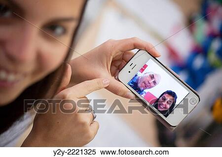 Girl with phone and "Selfie". View Large Photo Image Stock Photography - Girl with phone and "Selfie".. Fotosearch