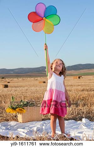 girl with pinwheel View Large Photo Image Stock Image - girl with pinwheel. Fotosearch