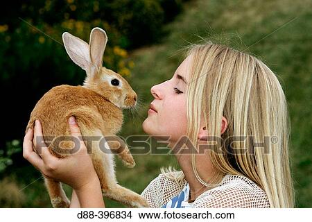 Girl with rabbit View Large Photo Image Picture - Girl with rabbit. Fotosearch