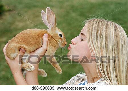 Girl with rabbit View Large Photo Image Stock Image - Girl with rabbit. Fotosearch
