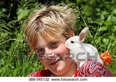Girl with rabbit View Large Photo Image Stock Image - Girl with rabbit. Fotosearch