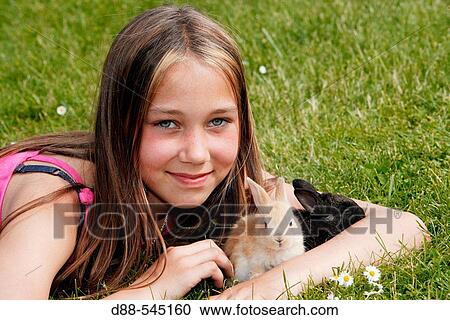 Girl with rabbit View Large Photo Image Stock Image - Girl with rabbit. Fotosearch