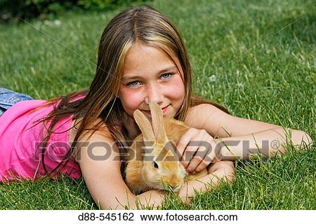 Girl with rabbit View Large Photo Image Stock Image - Girl with rabbit. Fotosearch