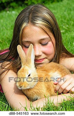 Girl with rabbit View Large Photo Image Stock Image - Girl with rabbit. Fotosearch