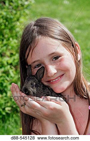 Girl with rabbit View Large Photo Image Stock Photo - Girl with rabbit. Fotosearch