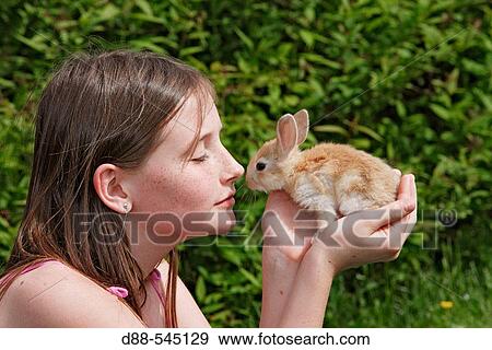 Girl with rabbit View Large Photo Image Stock Photo - Girl with rabbit. Fotosearch
