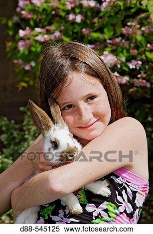 Girl with rabbit View Large Photo Image Stock Photography - Girl with rabbit. Fotosearch