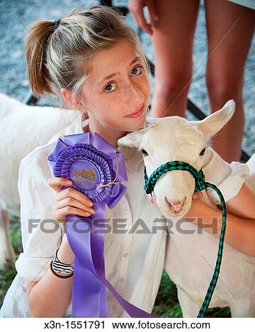 Girl with ribbon winning lamb at the Mason Dixon Fair View Large Photo Image Stock Image - Girl with ribbon winning lamb at the Mason Dixon Fair. Fotosearch