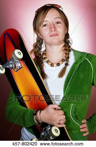 Stock Image - Girl with skateboard. Fotosearch