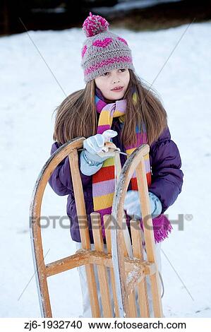 Girl with sleds View Large Photo Image Stock Image - Girl with sleds. Fotosearch