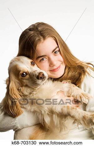 Girl with spaniel in studio View Large Photo Image Stock Image - Girl with spaniel in studio. Fotosearch