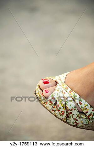 Girl with summer shoe and red nails View Large Photo Image Stock Image - Girl with summer shoe and red nails. Fotosearch
