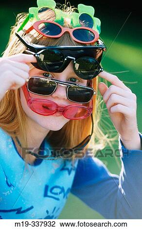 Stock Image - Girl with sunglasses. Fotosearch