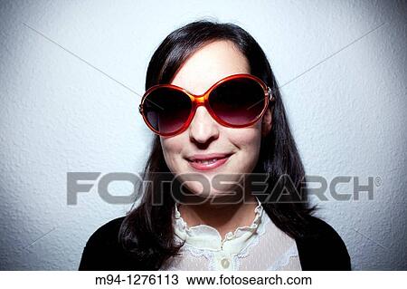 Girl with sunglassess looking at camera View Large Photo Image Stock Image - Girl with sunglassess looking at camera. Fotosearch