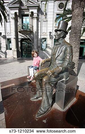 Girl with the the monument of Hans Christian Andersen in MBlaga, Andaluc? a, Spain, Europe View Large Photo Image Picture - Girl with the the monument of Hans Christian Andersen in MBlaga, Andaluc? a, Spain, Europe. Fotosearch