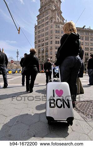 Stock Image - Girl with trolley Barcelona Catalonia Spain. Fotosearch