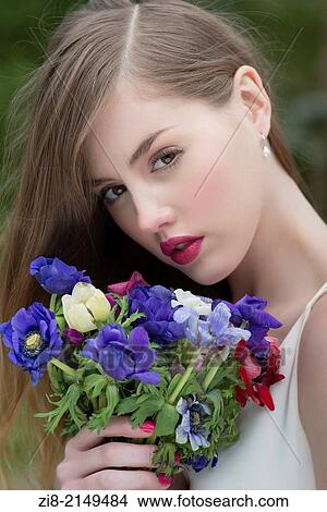 Girl with wild flowers bouquet. View Large Photo Image Picture - Girl with wild flowers bouquet.. Fotosearch