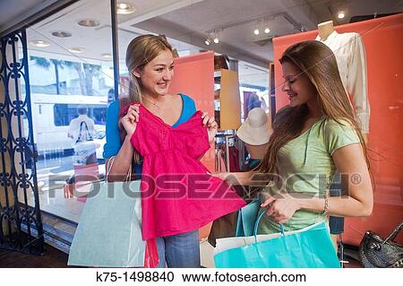 Girlfriend showing her new purchase View Large Photo Image Stock Image - Girlfriend showing her new purchase. Fotosearch