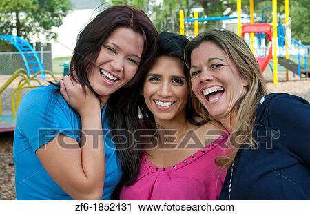 Girlfriends having fun in park aged 30s laughing and excitement in outdoors playground buddies View Large Photo Image Stock Image - Girlfriends having fun in park aged 30s laughing and excitement in outdoors playground buddies. Fotosearch