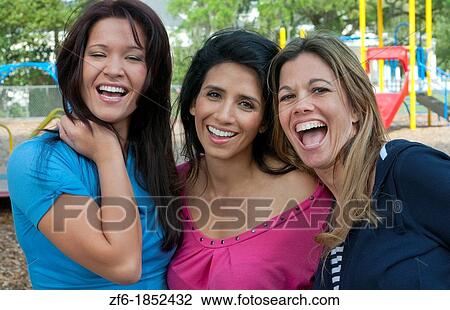 Girlfriends having fun in park aged 30s laughing and excitement in outdoors playground buddies View Large Photo Image Stock Image - Girlfriends having fun in park aged 30s laughing and excitement in outdoors playground buddies. Fotosearch