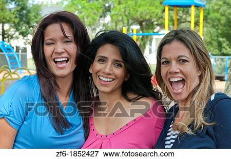 Girlfriends having fun in park aged 30s laughing and excitement in outdoors playground buddies View Large Photo Image Stock Photo - Girlfriends having fun in park aged 30s laughing and excitement in outdoors playground buddies. Fotosearch